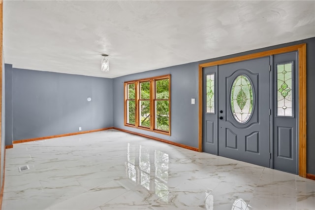 entrance foyer featuring tile floors