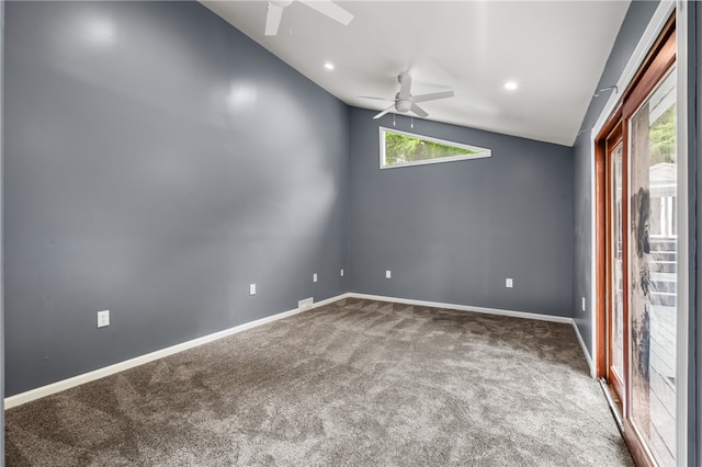 spare room with carpet, ceiling fan, and vaulted ceiling