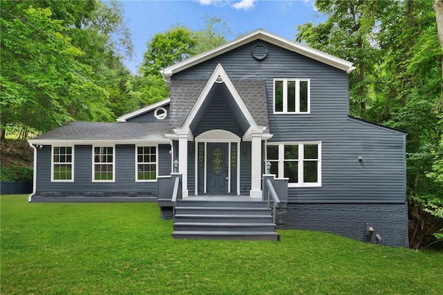 rear view of house with a lawn