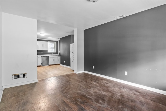 unfurnished living room with light hardwood / wood-style flooring