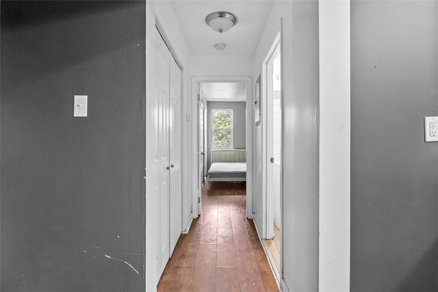 corridor with dark wood-type flooring