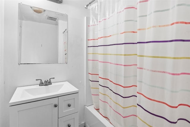 bathroom featuring vanity and shower / tub combo