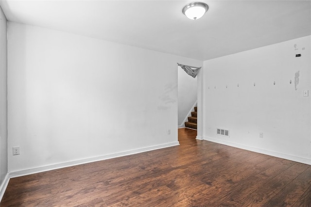 unfurnished room featuring dark hardwood / wood-style floors