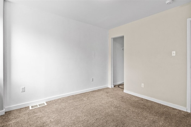 unfurnished room featuring carpet