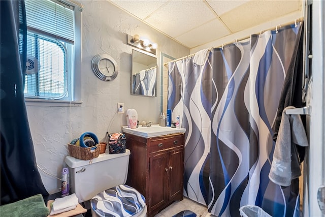 bathroom with vanity and a paneled ceiling