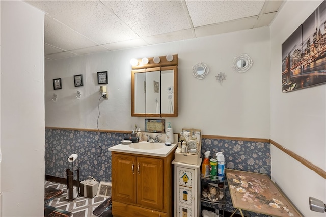 bathroom with vanity and a paneled ceiling