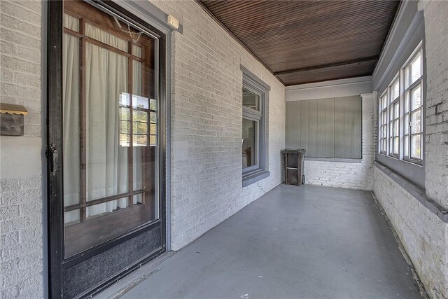 exterior space featuring wooden ceiling and plenty of natural light