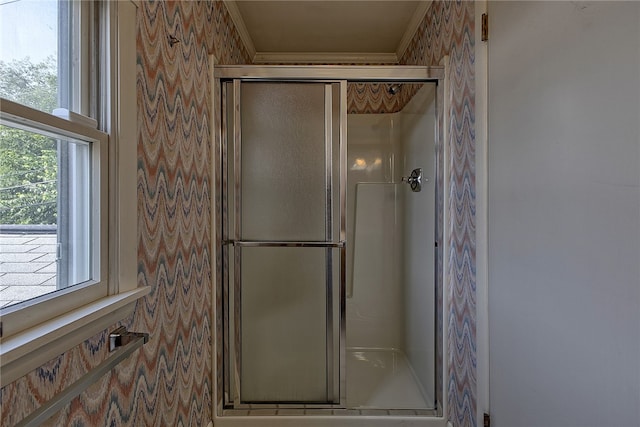 bathroom with a shower with shower door