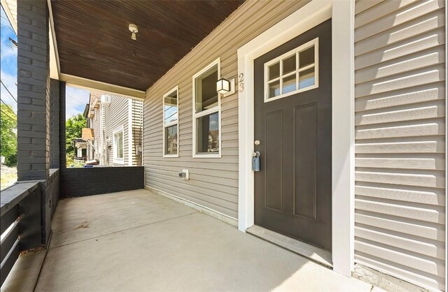 doorway to property with a porch