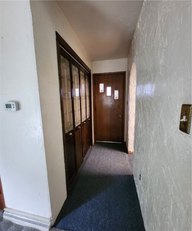 corridor featuring carpet floors