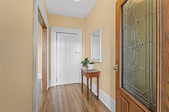 foyer entrance with light wood-type flooring