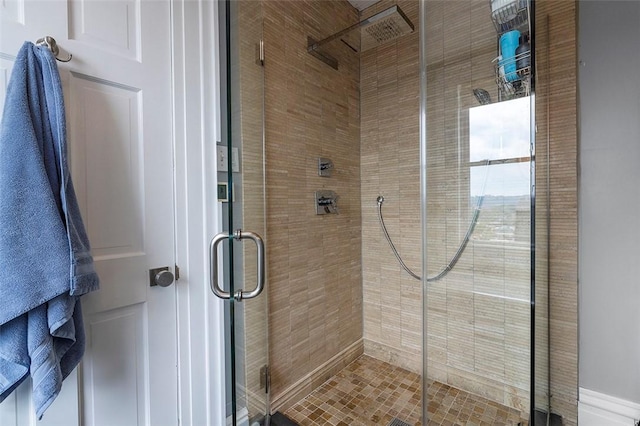 bathroom with a shower with shower door