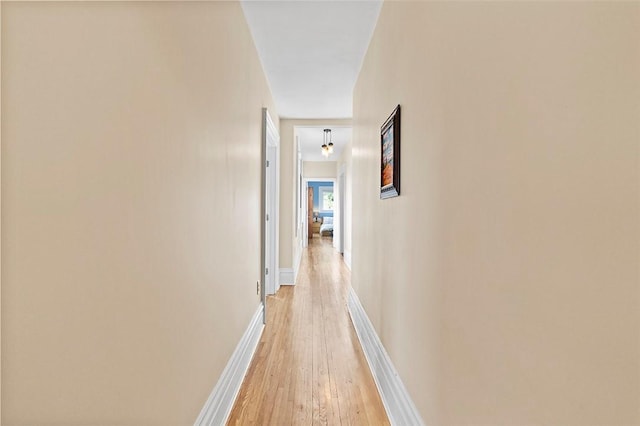 hallway with light wood-type flooring