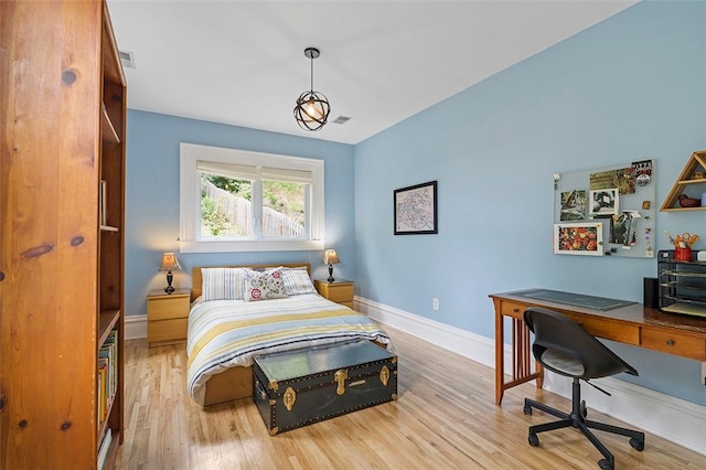 bedroom with light wood-type flooring