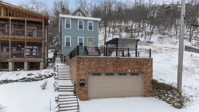 view of front of house with a balcony and a garage