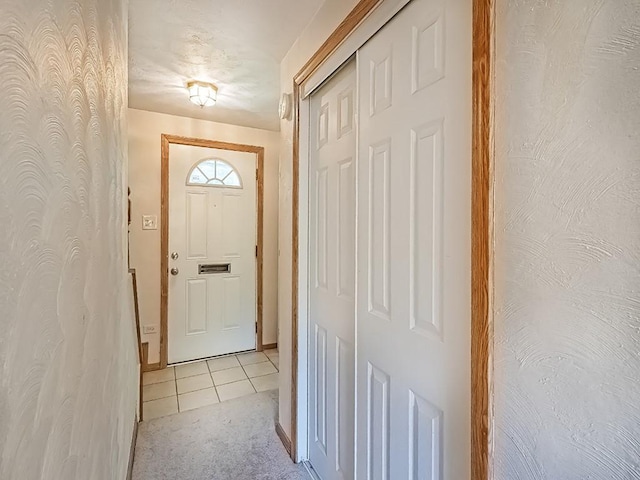 entryway featuring light tile patterned flooring