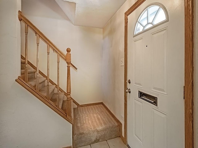 entryway with light tile patterned floors