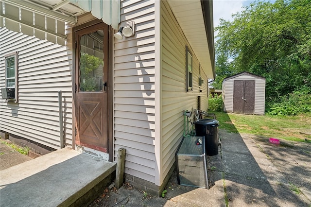 view of property exterior with a storage unit