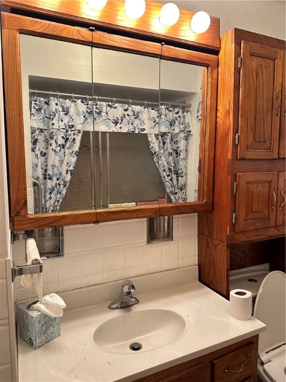 bathroom with backsplash and vanity