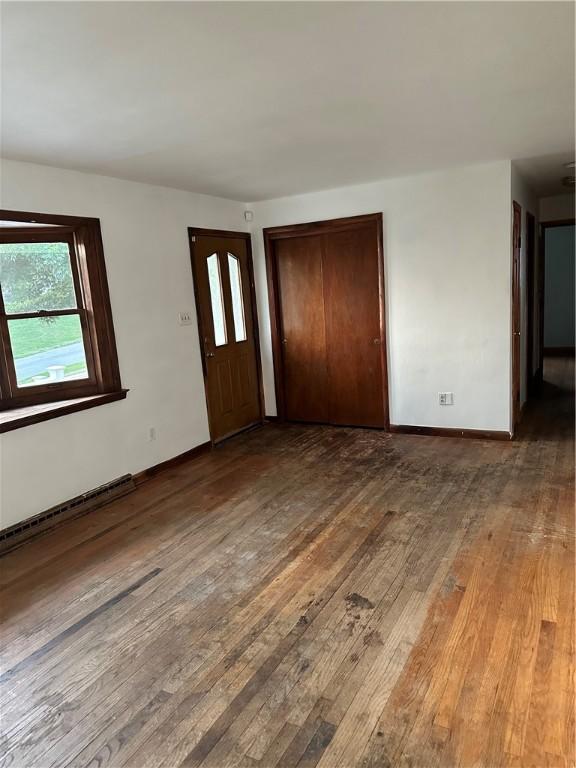 foyer entrance with dark hardwood / wood-style flooring