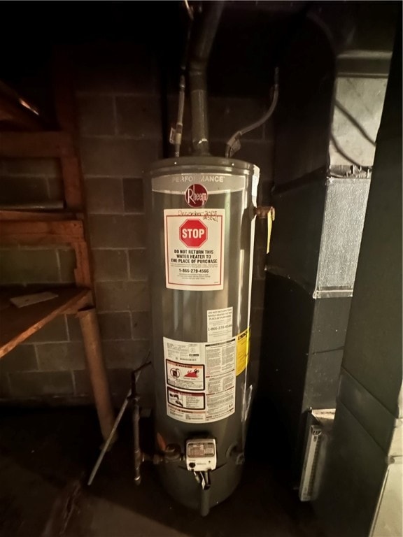 utility room featuring water heater