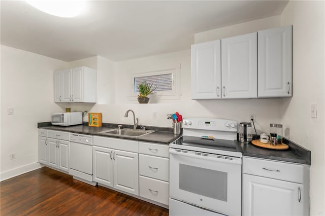 kitchen featuring sink, white cabinetry, white appliances, and dark hardwood / wood-style flooring