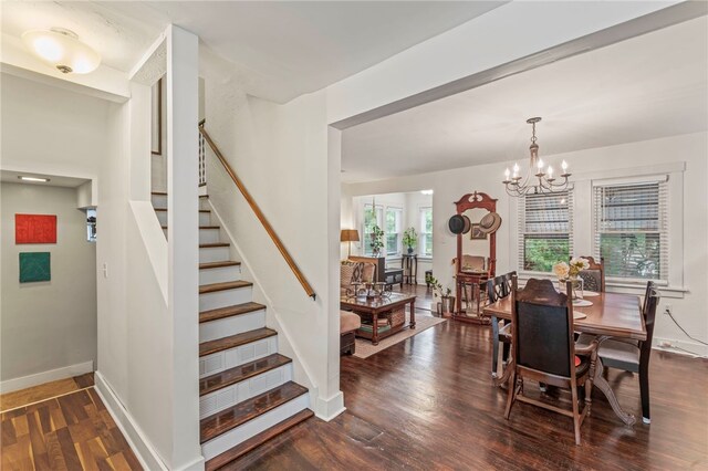 dining area featuring a chandelier and dark hardwood / wood-style flooring