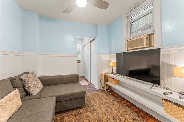 1534 Mcfarland Rd, Dormont, PA 15216 - living area with wainscoting, radiator, wood finished floors, a ceiling fan, and cooling unit