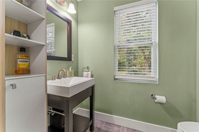 bathroom with toilet and sink