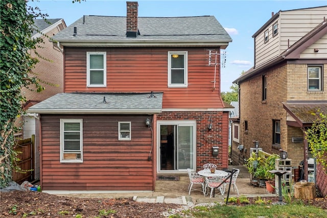 back of house with a patio area