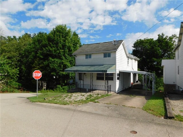 view of front of property with a carport