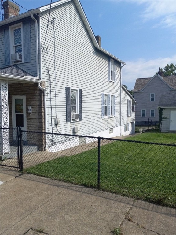 view of home's exterior with a lawn