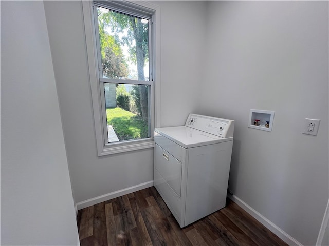 washroom featuring washer / clothes dryer, dark wood-type flooring, and a wealth of natural light