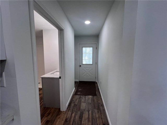 hall featuring dark wood-type flooring