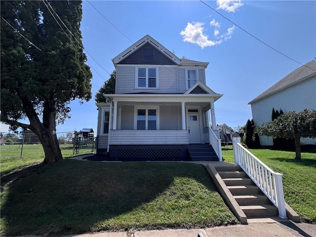 view of front of house with a front lawn and a porch