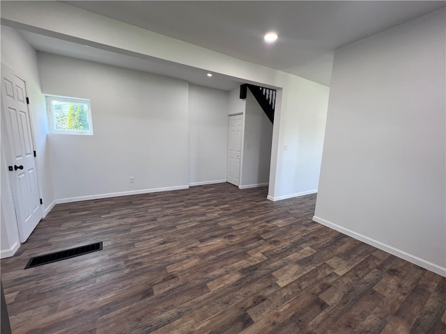 basement with dark wood-type flooring