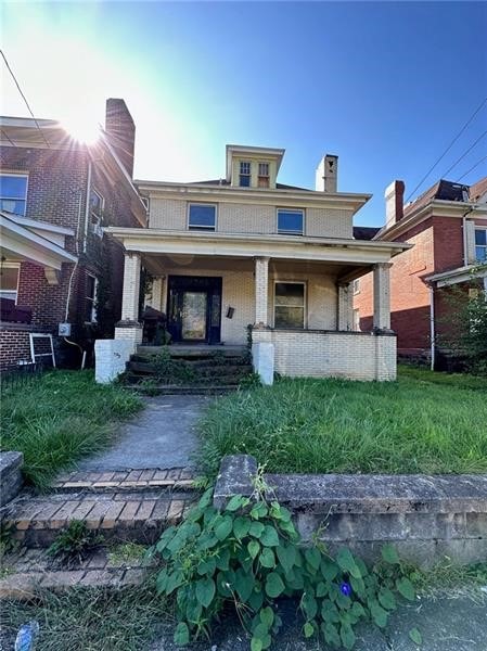 rear view of house with a porch