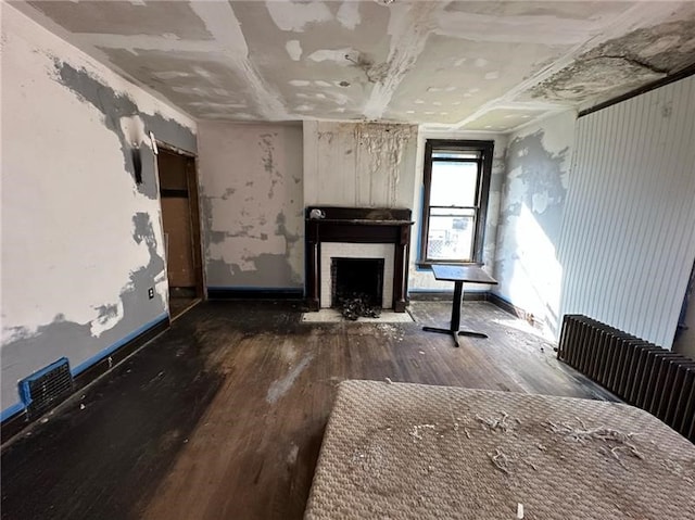 unfurnished living room with hardwood / wood-style flooring