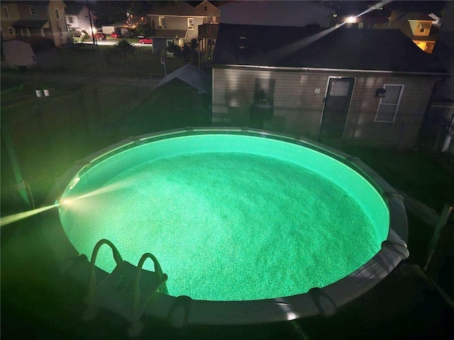 view of pool at night