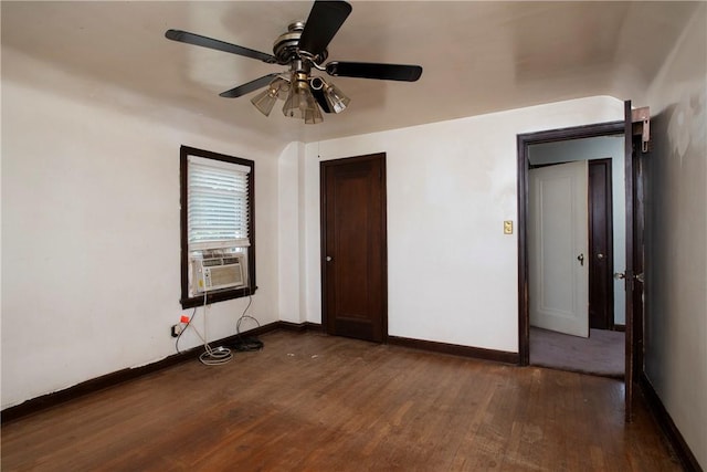 unfurnished bedroom with dark hardwood / wood-style flooring, cooling unit, a closet, and ceiling fan