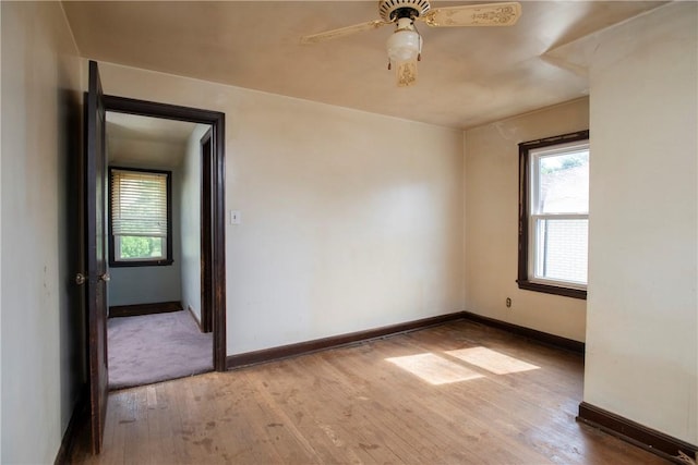 unfurnished room with wood-type flooring and ceiling fan