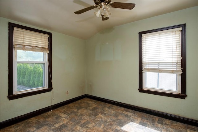 empty room featuring lofted ceiling