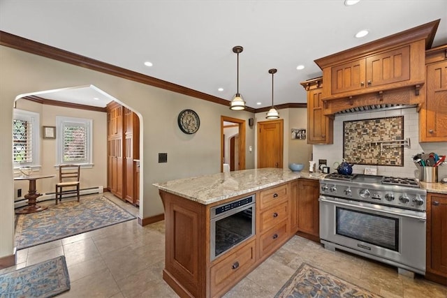 kitchen featuring tasteful backsplash, high end range, decorative light fixtures, kitchen peninsula, and a baseboard heating unit