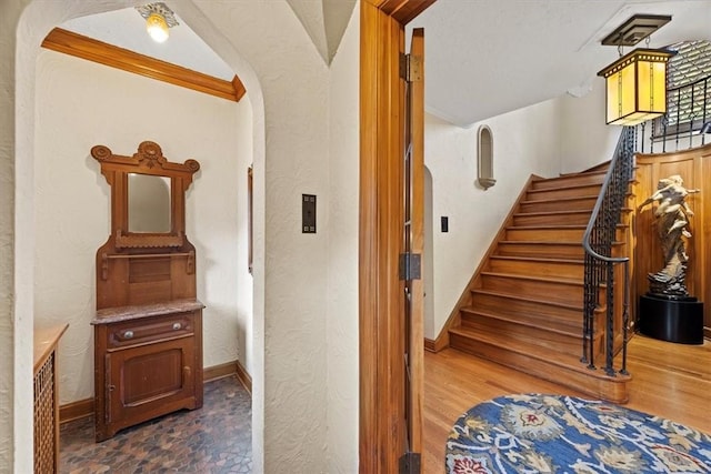 stairs featuring hardwood / wood-style floors