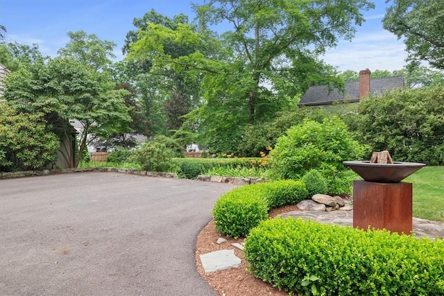 surrounding community featuring a fire pit