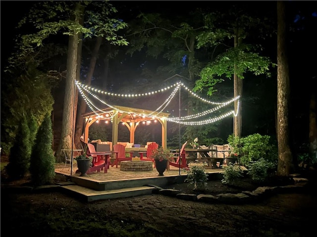 view of property's community with an outdoor fire pit