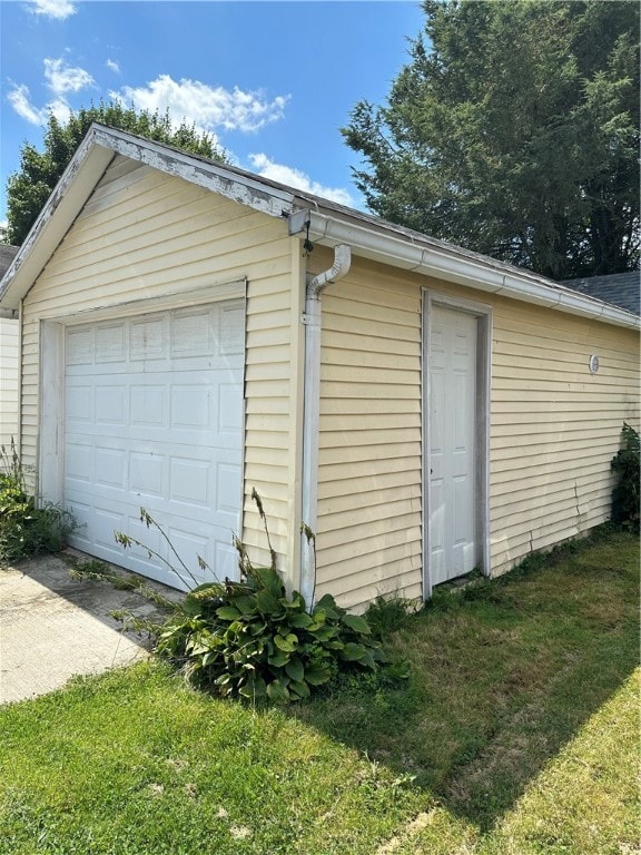 garage with a yard