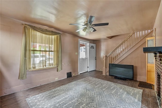 entryway with dark hardwood / wood-style floors and ceiling fan