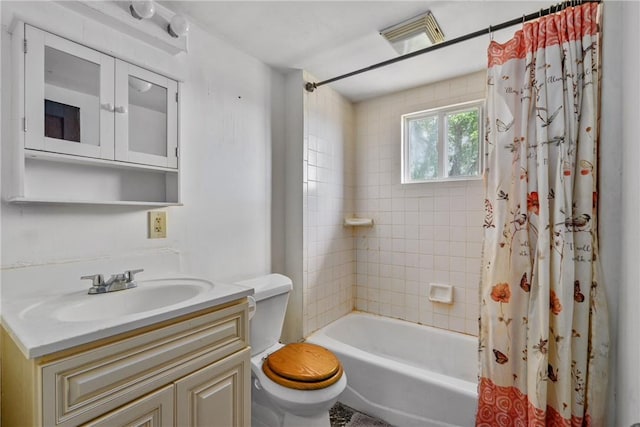 full bathroom with vanity, toilet, and shower / bathtub combination with curtain