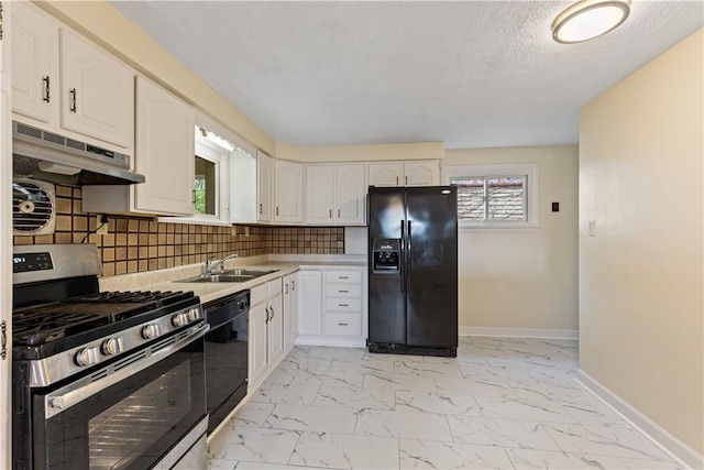 kitchen with backsplash, white cabinetry, sink, and black appliances